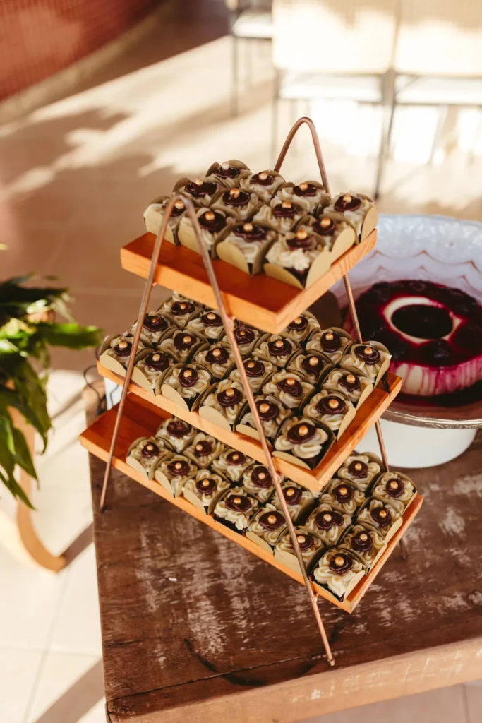 Tiered serving stand with side dishes on a small Thanksgiving table